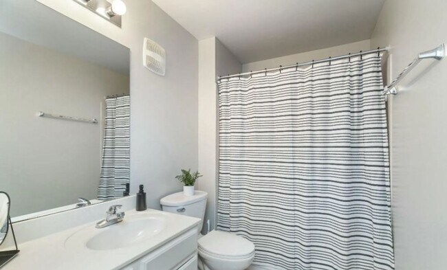 Building Photo - Two Bedrooms Available in this Three Bedroom Flat, Female Applicants!