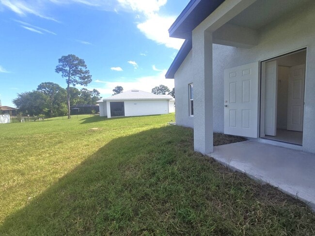 Building Photo - BRAND NEW-- TWO BEDROOM + TWO BATHROOMS- SOUTH LEHIGH ACRES