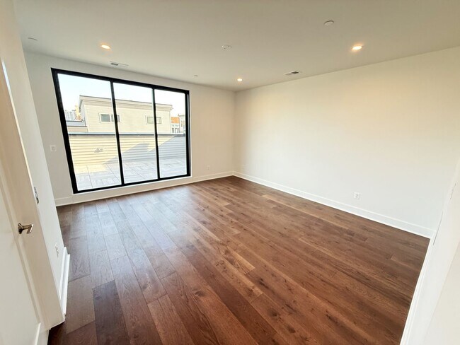 Building Photo - Brand new 4 level, 4 Bedroom Townhome with Elevator!