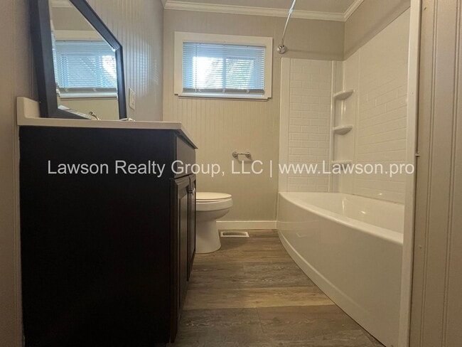 Building Photo - Charming Brick Ranch with Beautifully Landscaped Yard and Attached Carport