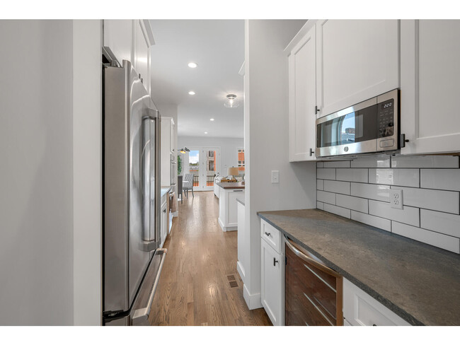 Kitchen includes pantry, bar, near dining room - 2245 Hickory St