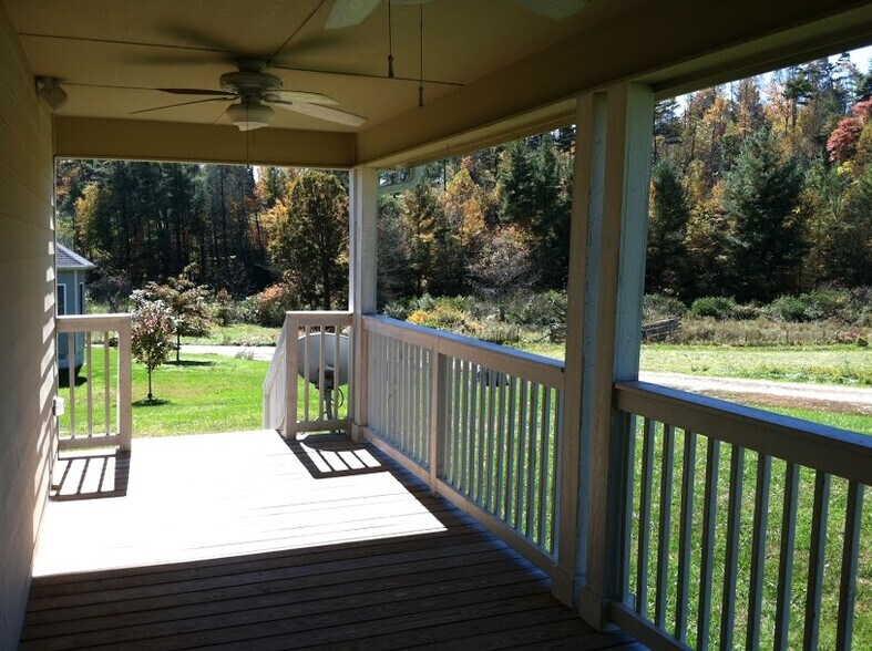 Spacious covered back porch with ceiling fans - 45 Harper Meadow Way