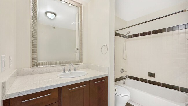 Building Photo - Exceptional Corner Unit w/ Wraparound Sout...