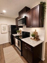 Granite Counters & Tile Backsplash - Porter Plaza Apartments