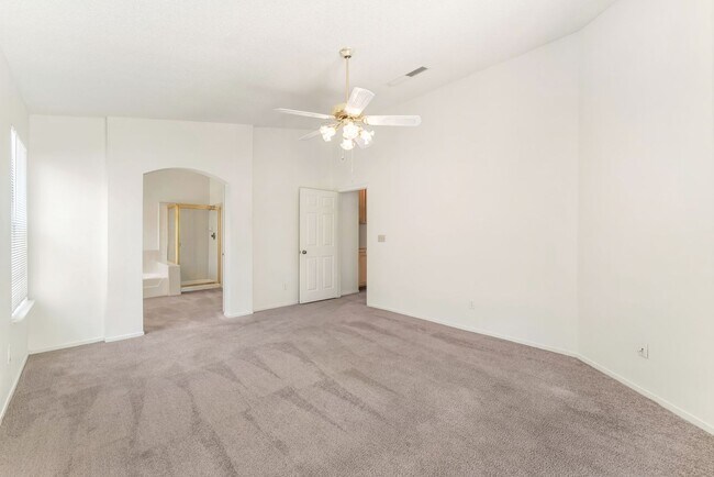 Building Photo - Vaulted Ceilings, Cozy Fireplace & Desirable Single-Story Living Near The Lakes!