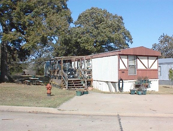 Building Photo - Whispering Oaks Mobile Home Park