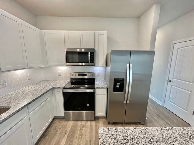 Building Photo - New 3 Bedroom, 2.5 Bathroom Townhouse w/ C...
