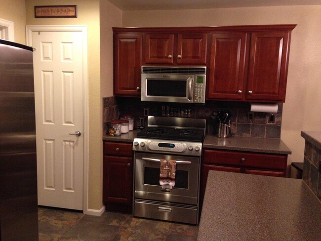 17-New stainless steel gas oven and microwave, pantry - 10653 Butte Dr