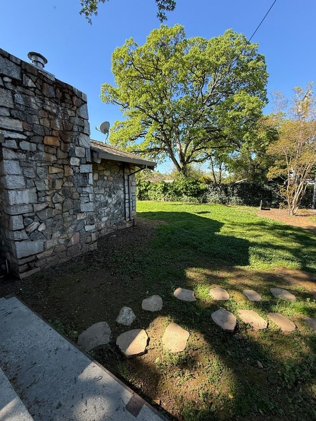 Building Photo - Charming Auburn Retreat with Vaulted Ceilings & Stone Fireplace
