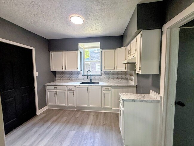 Building Photo - Three bedroom one bathroom single-family home for rent
