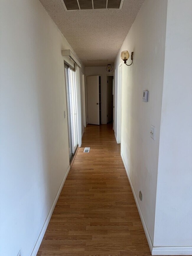 Building Photo - Charming 3-bedroom, 2-bathroom home is nes...