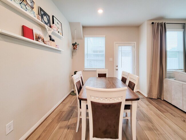 Building Photo - A true gem on a quiet corner lot, this spacious and sun-filled home is tucked away from street no...