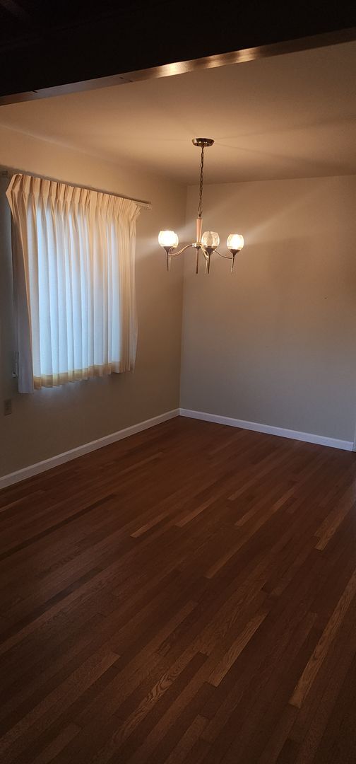 Building Photo - This is a spacious house featuring four bedrooms and two bathrooms, along with a two-car garage.