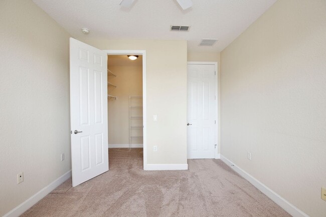 Building Photo - Stylish and Spacious 3/2.5 Townhome with Premium Features and Community Pools