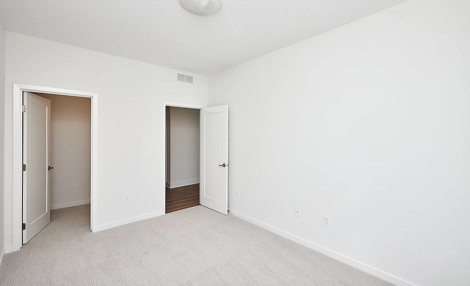 Guest Bedroom #1 with walk-in closet. - 216 E Center St