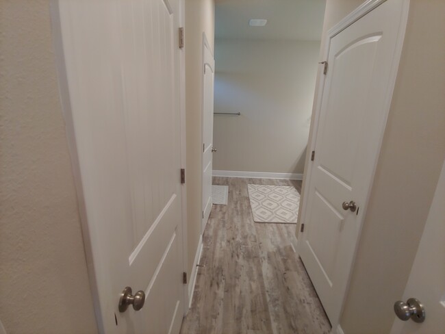 Master bath hallway - 2 separate walk in closets and water room - 133 Stonegate Drive