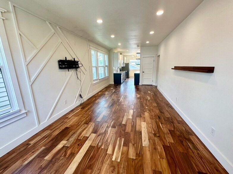 Living and dining area, with included TV mount - 723 N 80th St