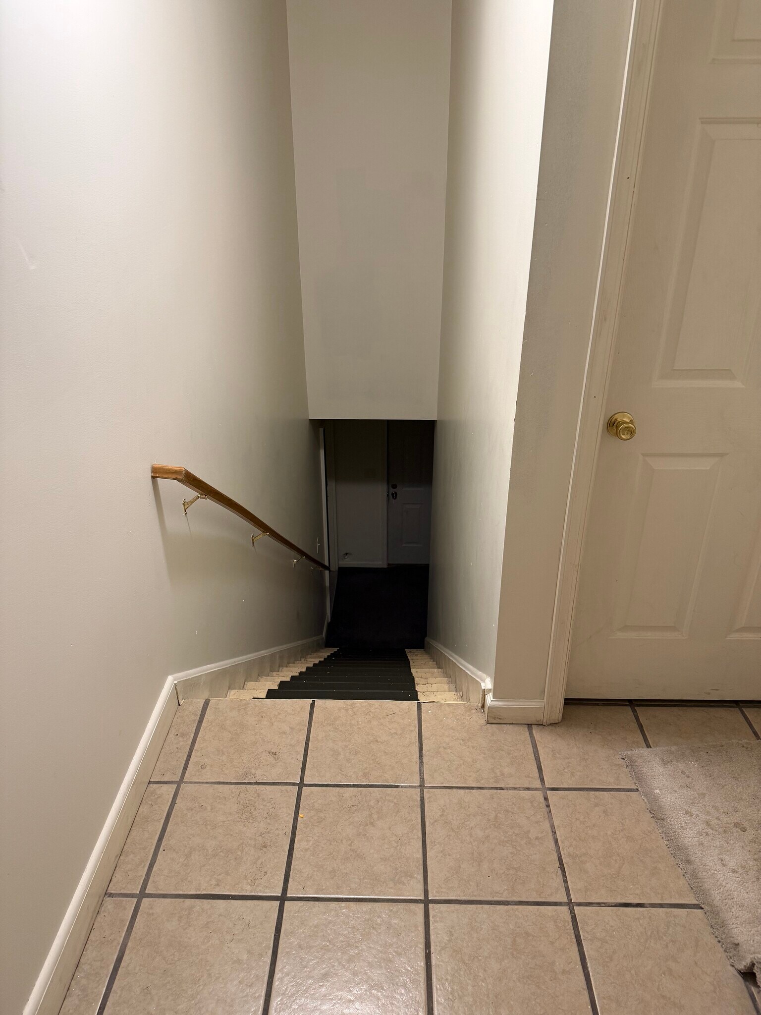 Wash and Dryer door to right, stairs up to unit - 218 N Queen St