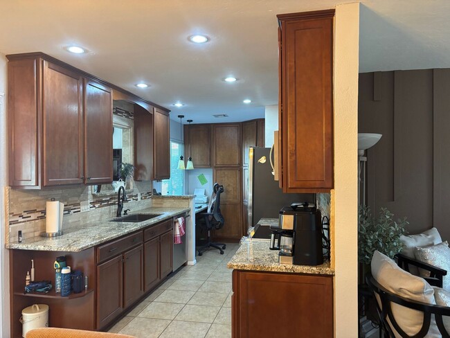 Building Photo - Welcome to this stunning updated 2-bedroom, 2-bathroom home on a lake located in the vibrant comm...