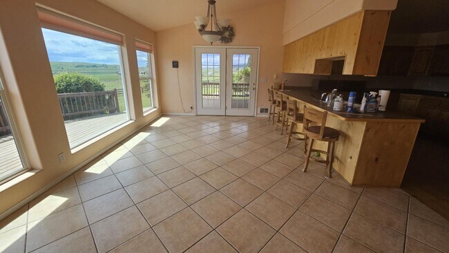 Building Photo - Out of town house with double garage and l...