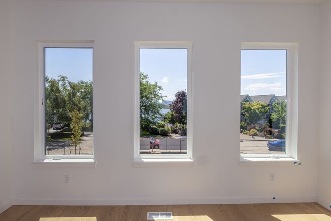 Building Photo - Riverside Townhomes - Waterfront Living in...