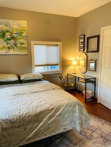 Vanity and door to closet. - 438 E 7th St