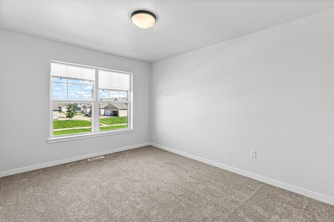 Building Photo - New 3 Bed Townhome with Covered Deck and Oversized Garage!