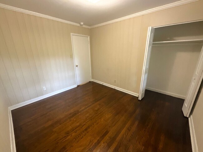 Building Photo - Reduced to $1550/mo! N Central Greensboro location, 3/2 brick home with lots of shade, fresh paint!