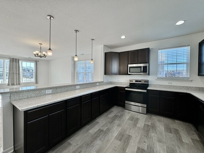 Building Photo - 3 Bedroom Townhome in Spence Crossing! Water/Sewer/Trash/Landscaping INCLUDED! - Attached Garage ...