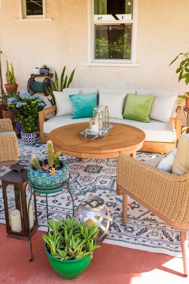 Patio furniture with comfortable seating area. - 1150 W 25th St