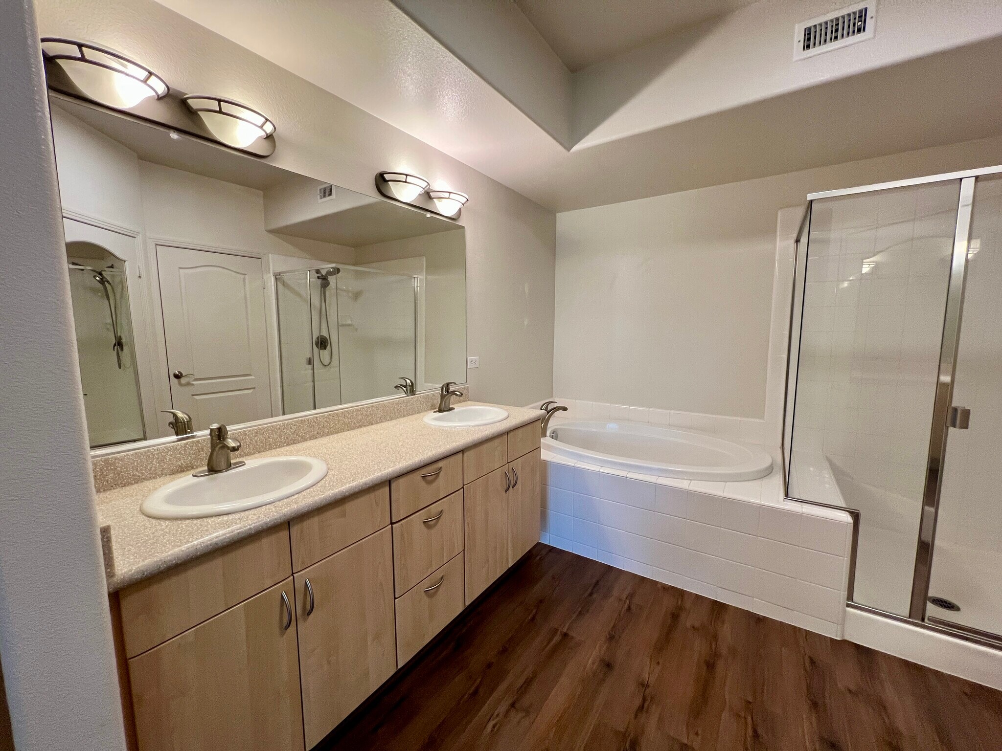 Primary bathroom - double vanity, soaking tub and shower - 8355 Station Village Ln