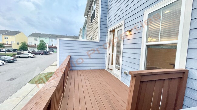 Building Photo - 3 Story Townhome 3 Bedrooms Rear Entry 2 Car Attached Garage with 1st Floor Bedroom, Community Po...