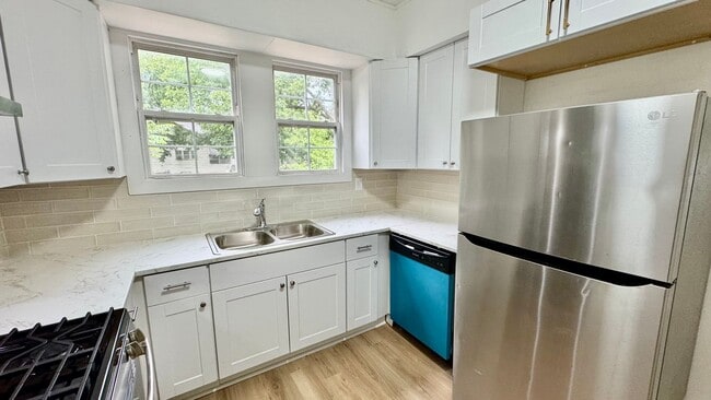 Building Photo - Spacious 3 Bedroom Home with Modern Updates & Shop