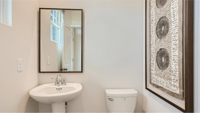 1st floor Chic powder room: Stylish, compact, a touch of elegance for guests - 13119 Cottage Crest Ln