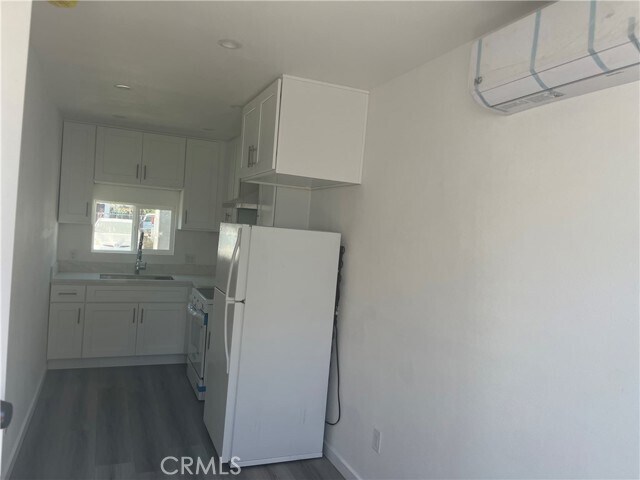 Building Photo - 1387 W Holt Ave