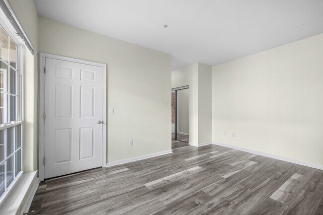 Building Photo - Two-bedroom, two-bathroom model with a den, located on the third floor.