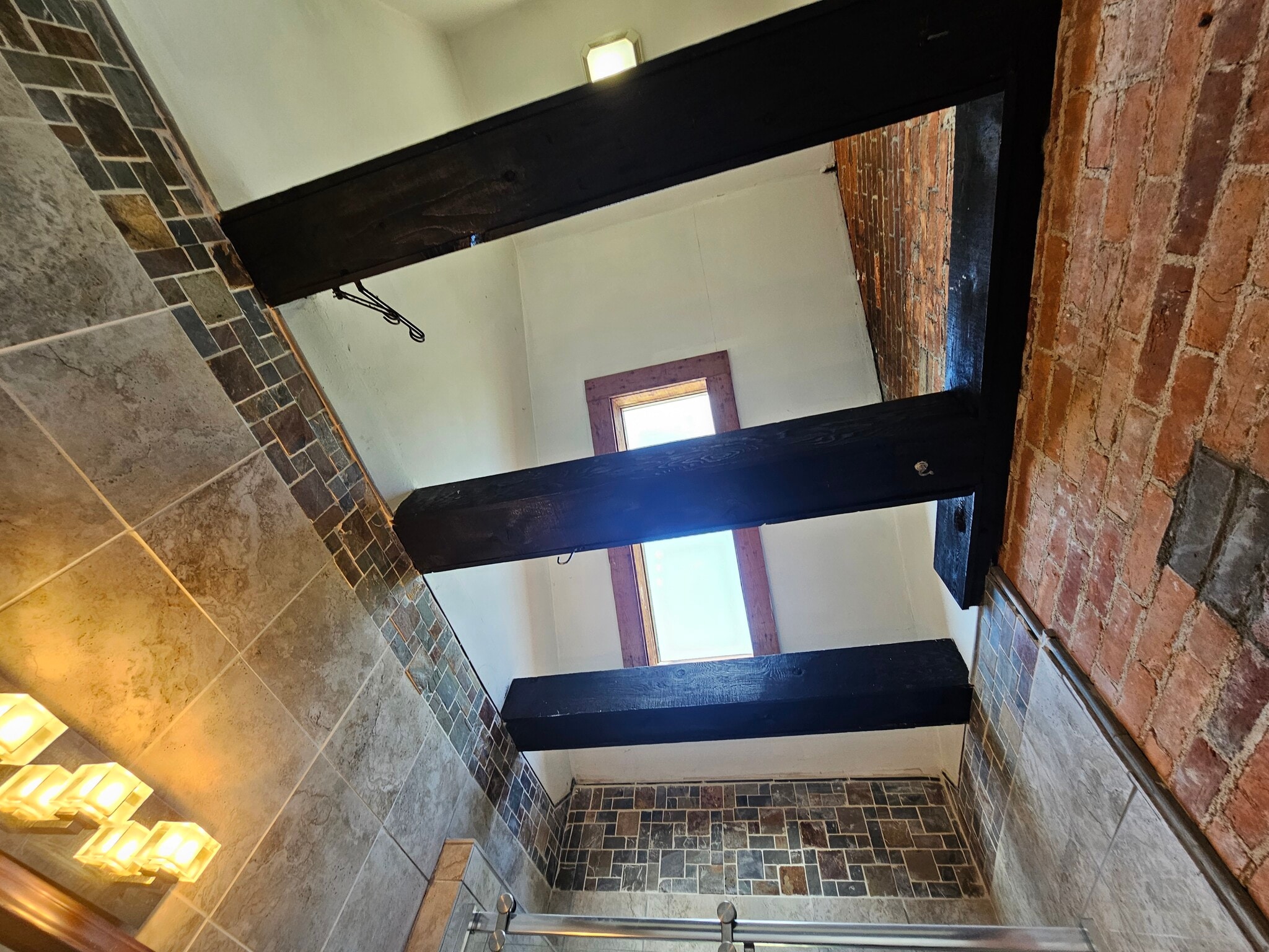 20foot ceiling with a skylight and exposed wooden beams - 943 Highland St
