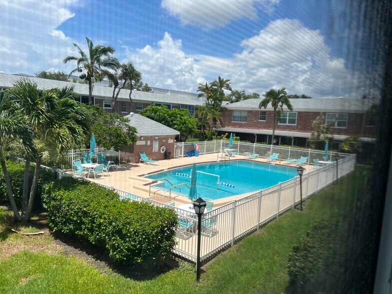 View of nearby swimming pool from the terrace - 3535 41st Ter S