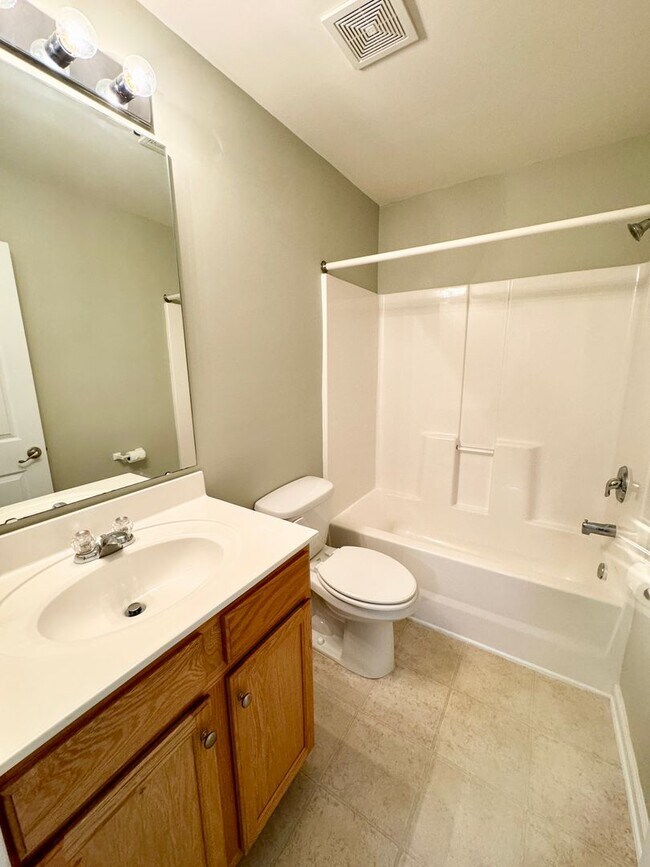 Building Photo - Like New 3 Bedroom & 2 Bath pond front home in Hillsborough! Enjoy the Community Pool, Playground...