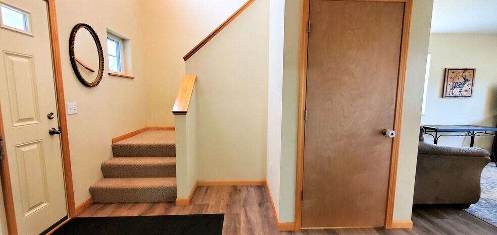 Stairs to upper level. (photo from neighboring unit with the same layout) - 1756 St Joseph St