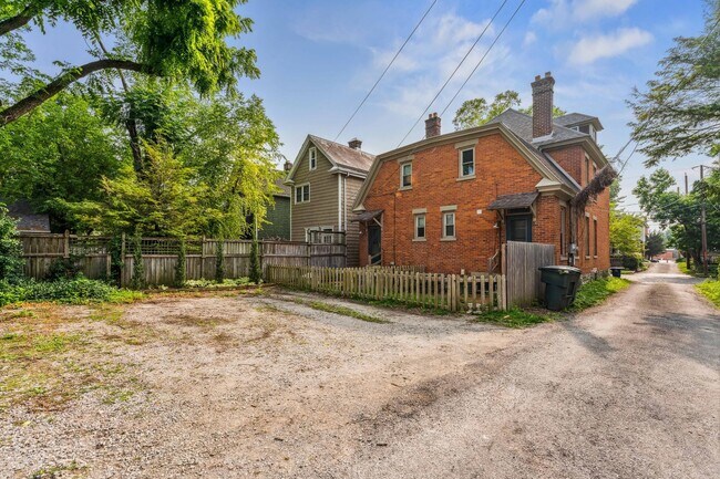 Rear with fenced yard and dedicated off street parking - 666 S 9th St