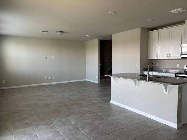 Building Photo - Like-New 4 Bedroom 3 Bath with Pond View & Two Living Spaces — Minutes to South Lake Nona
