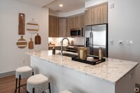 Building Photo - Live Elevated, Steps from It All