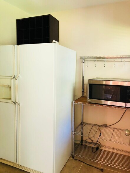 A second fridge is included in a large pantry/food prep space. A door makes hiding the dirty dishes easy from your guests! - 3 Tyrol Ct