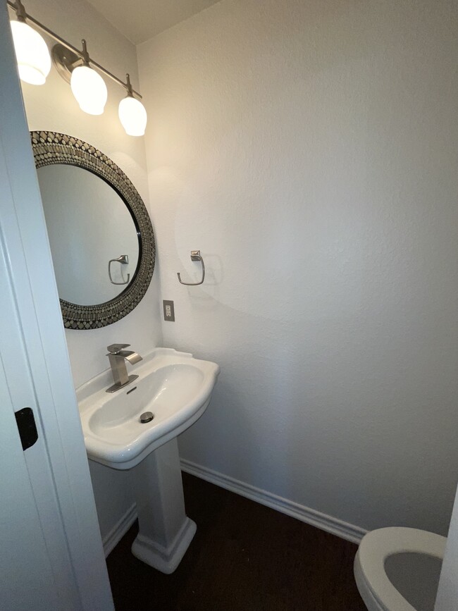 1/2 bath off of family room - 3809 Willie Mays Ln