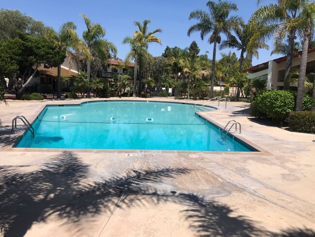 Building Photo - Beautiful Townhome with large fenced back patio, second story balcony, and two covered parking spots