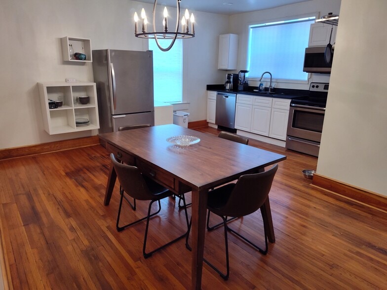 Large kitchen with granite countertops and wood floors - 1723 Nicholson Pl