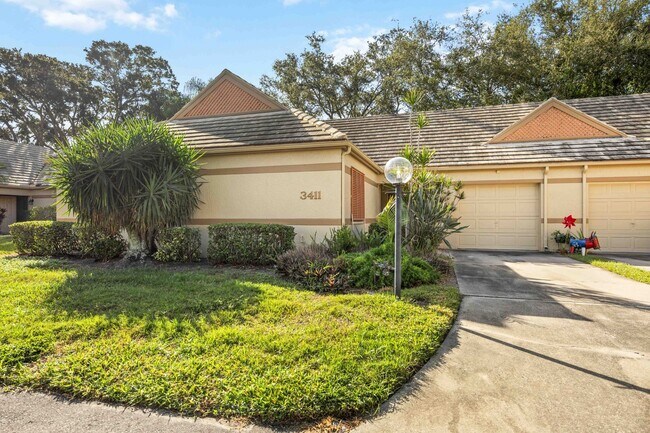 Building Photo - Beautiful Must See!! 3/2 Plus Sunroom & Garage!!  Gated Community!!