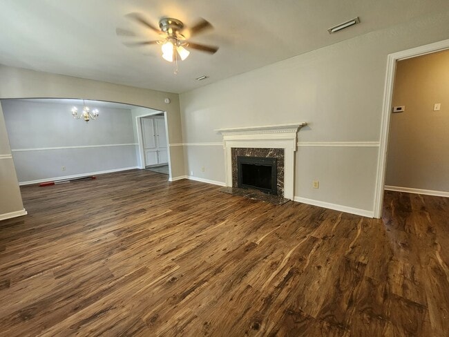 Building Photo - Spacious 4BR/2BA Brick Home with Fireplace, Large Island! NEW LVP Floors throughout!