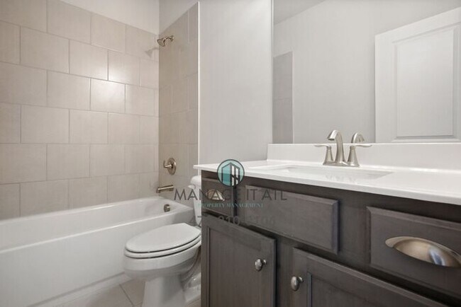 Building Photo - Modern 3-level Townhome featuring 4 bedrooms and 3 1/2 baths